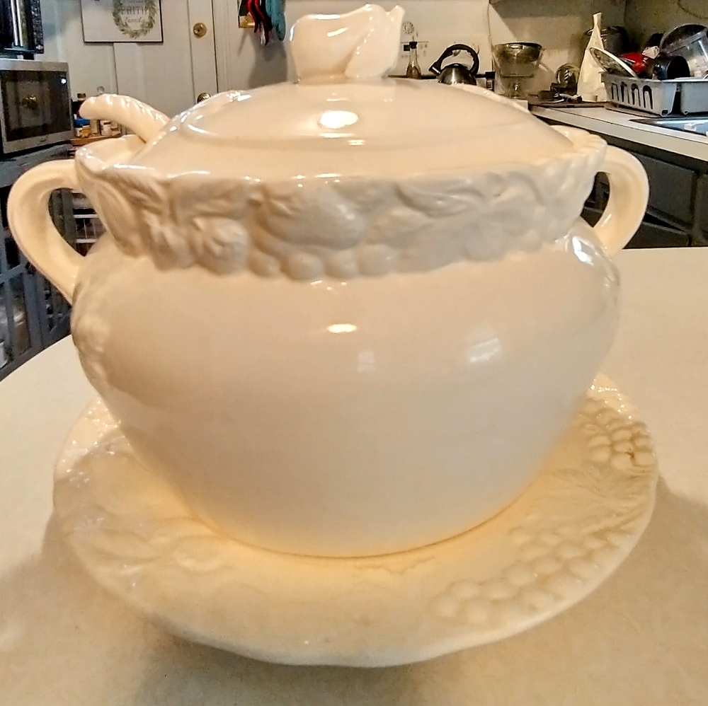 Vintage soup tureen with ladle and plate